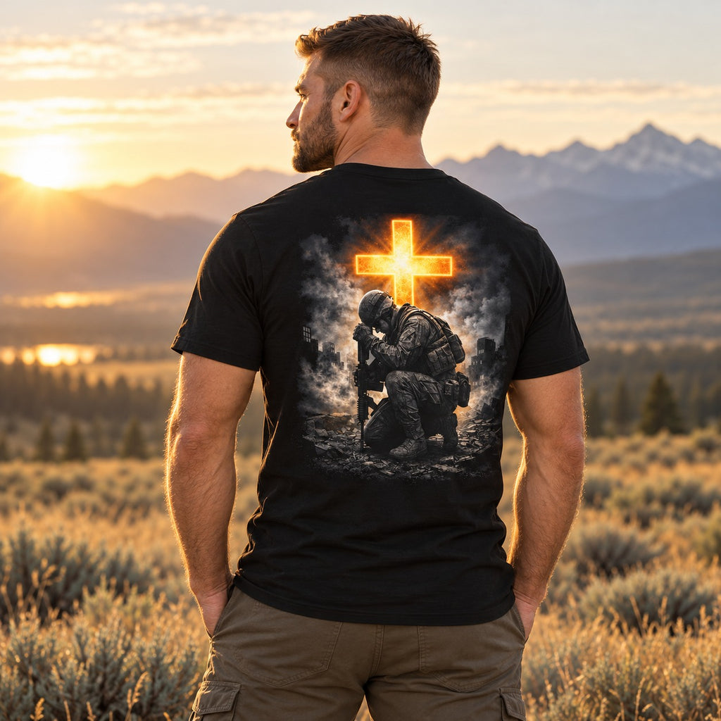 Back of the black Send Me tee on a model: kneeling soldier beneath a glowing cross
