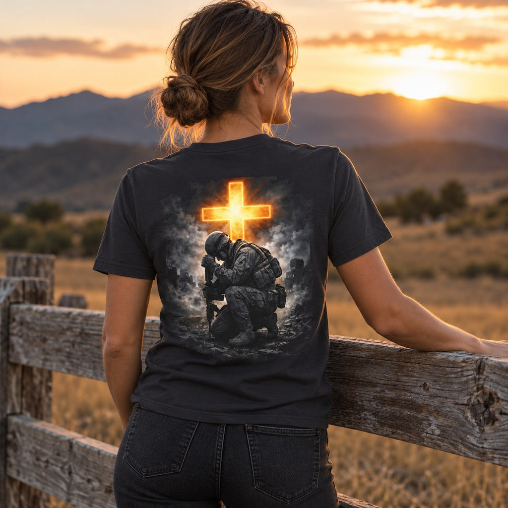 Back of the dark grey Send Me tee on a model: kneeling soldier beneath a glowing cross